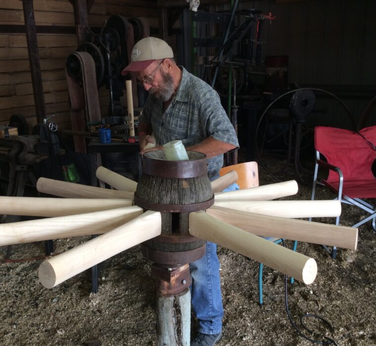 Bill Radway with hub + spokes for a heavy grain wagon